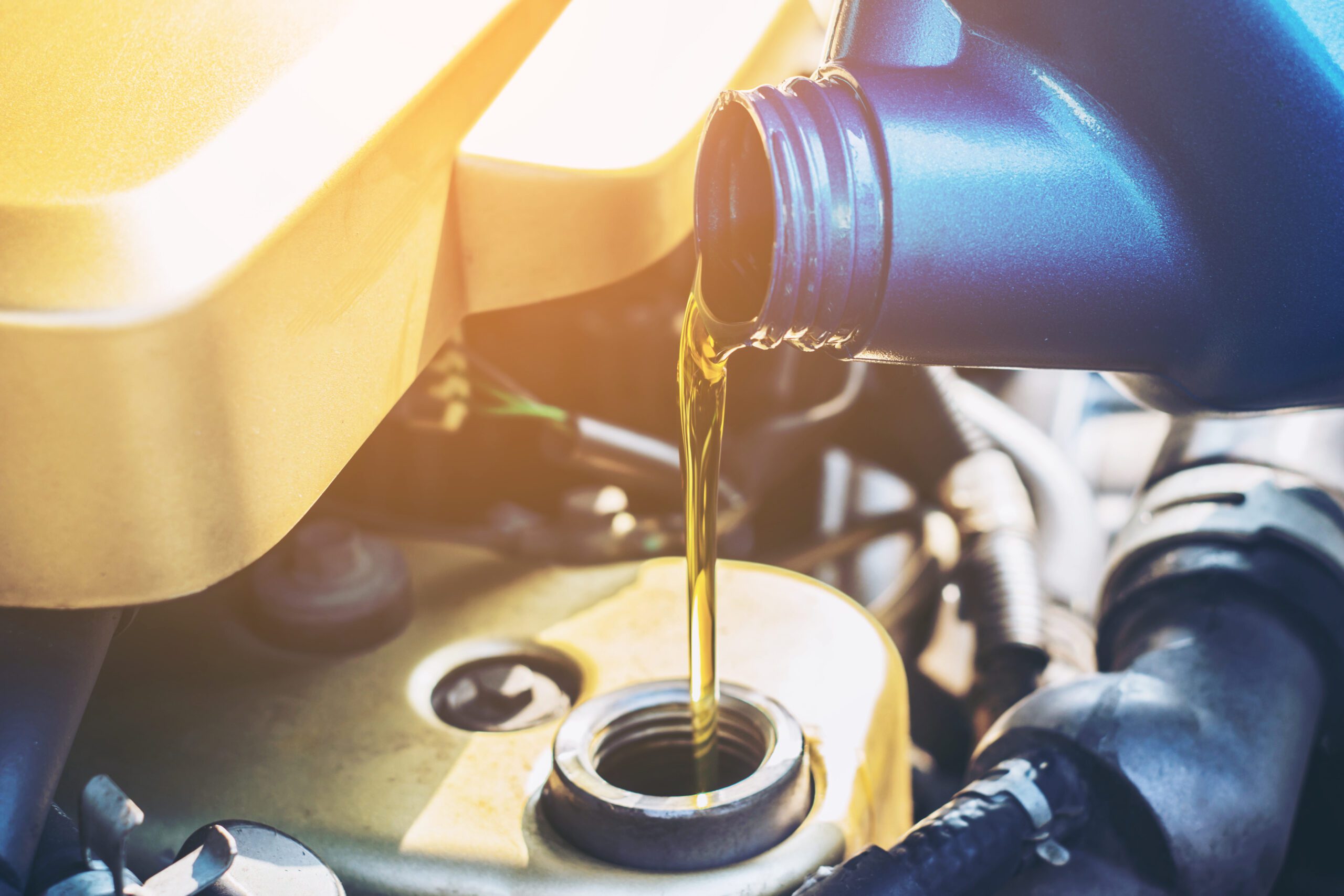 Close up of filling oil in machine